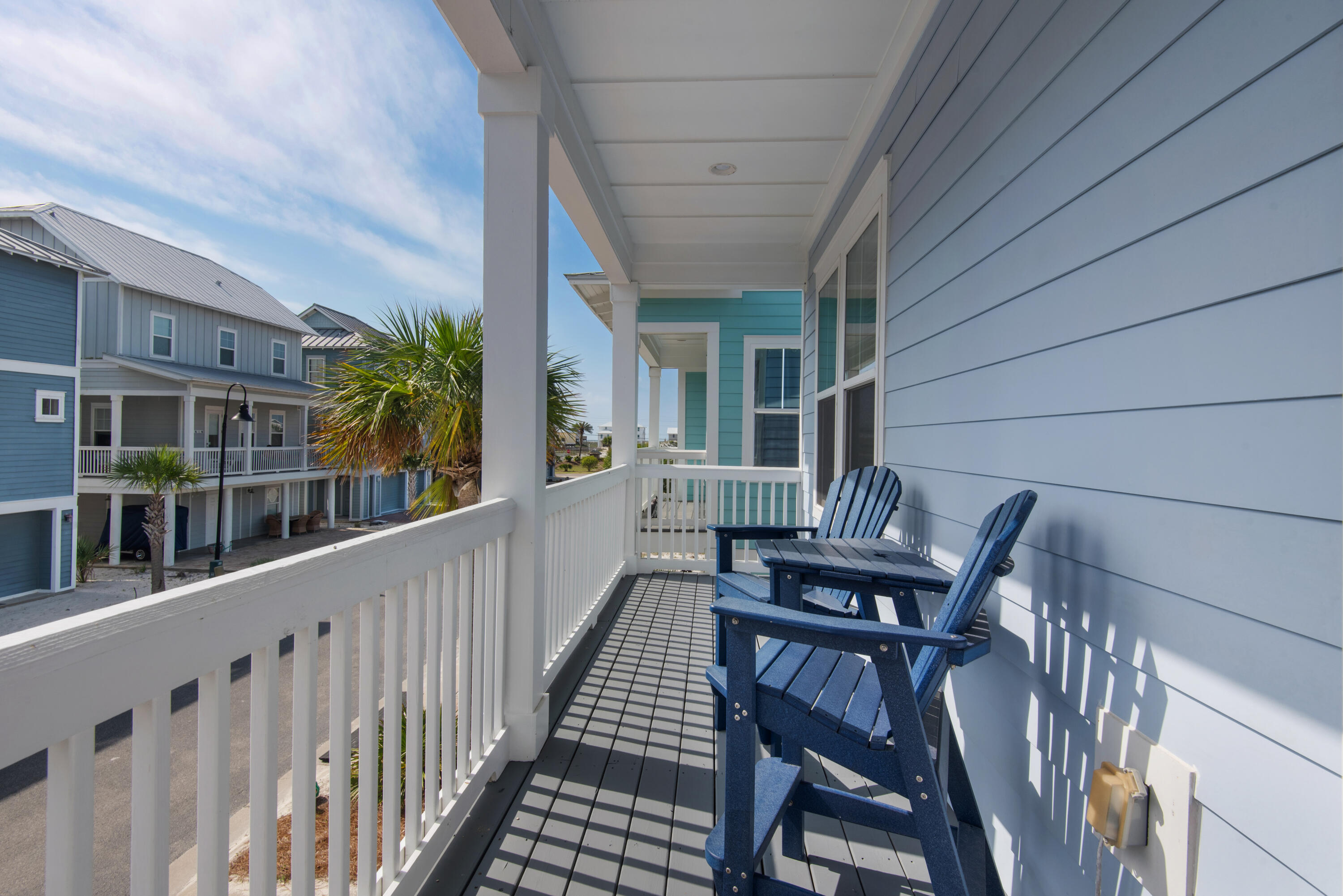 1494 Seaside Circle Navarre, FL 32566 - Photo 60 of 69 a view of an chairs and table in the balcony