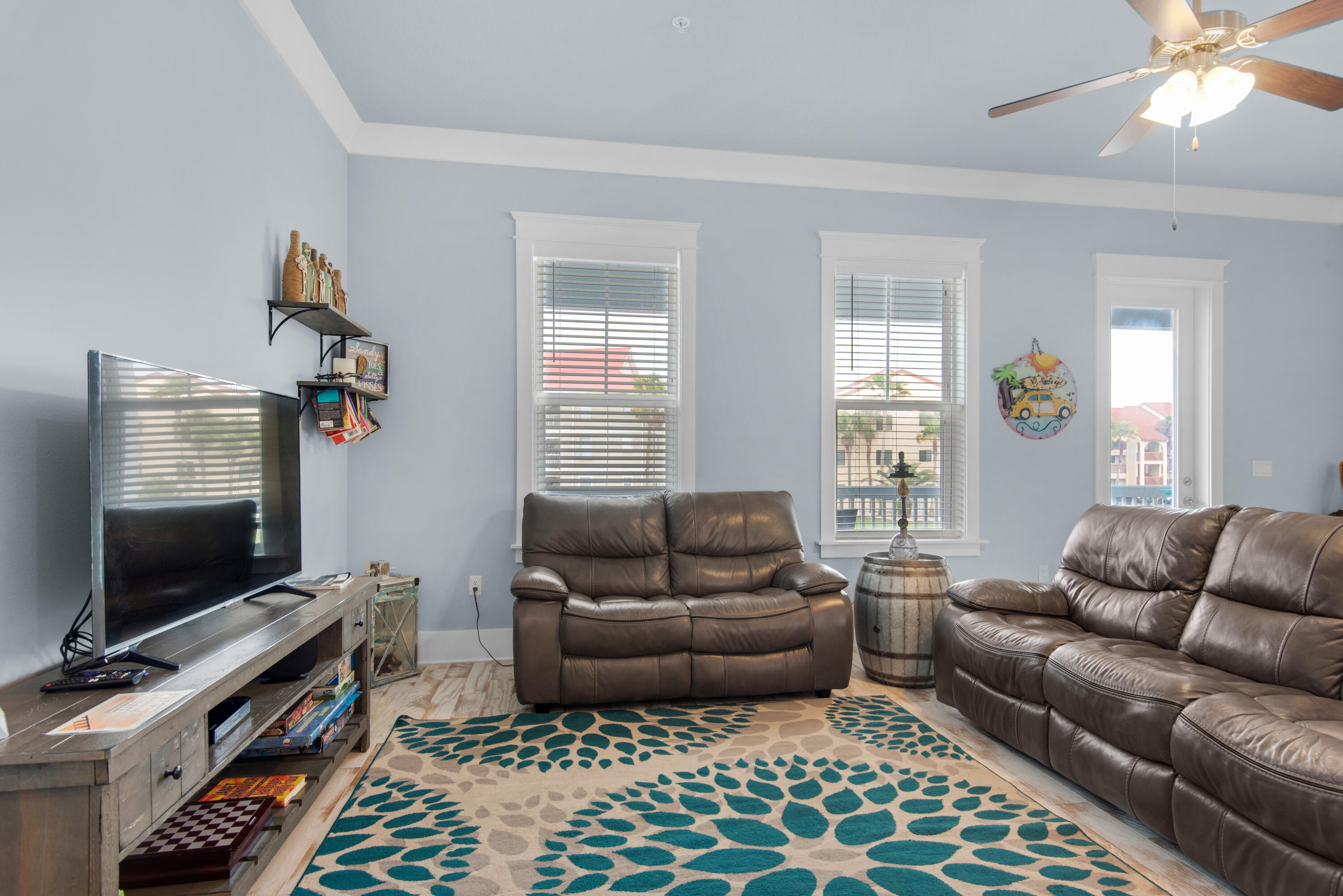 1494 Seaside Circle Navarre, FL 32566 - Photo 8 of 69 a living room with furniture and a flat screen tv