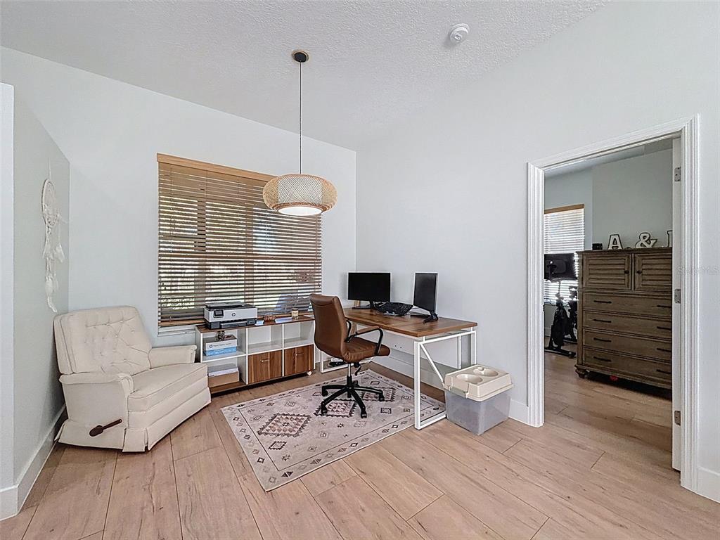 3365 Indian River Street Spring Hill, FL 34609 - Photo 15 of 38 a workspace with furniture hardwood and a window