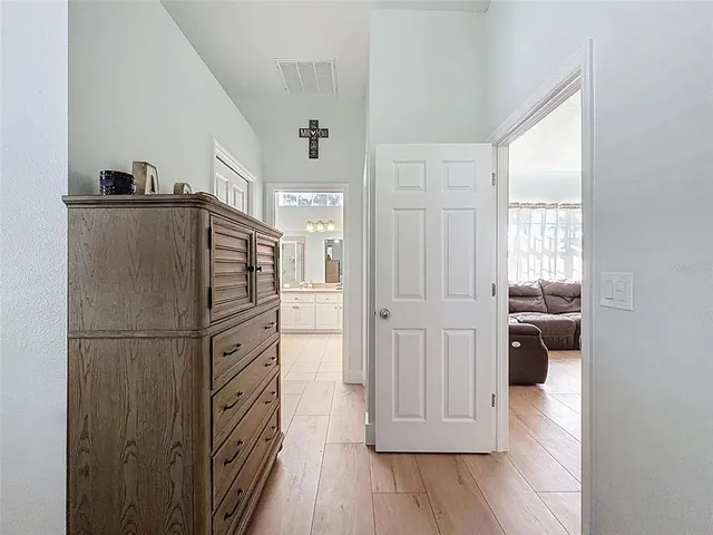 a bathroom with a sink a toilet a mirror and shower curtain