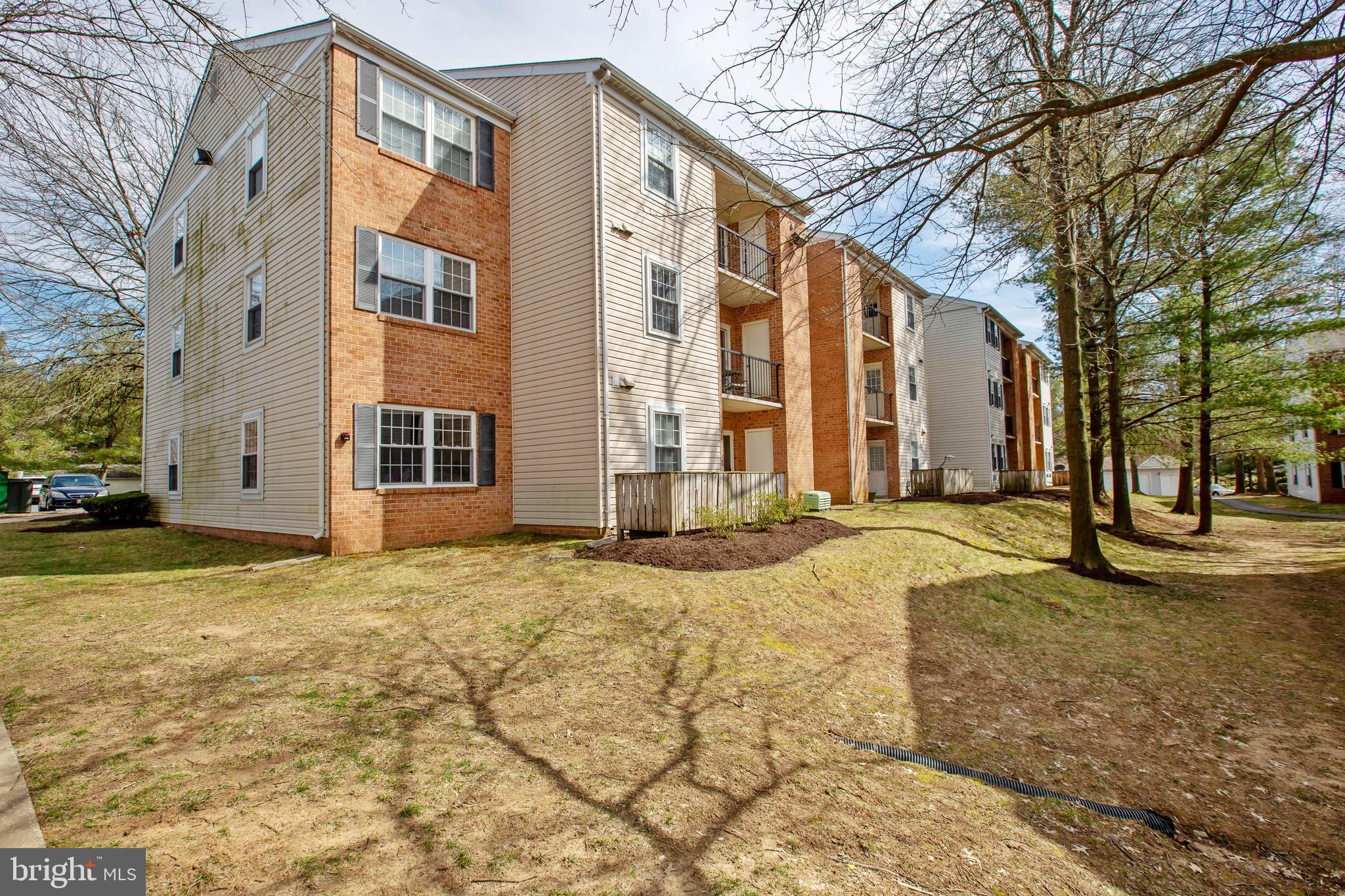 18318 Streamside Drive, Unit 203 Gaithersburg, MD 20879 - Photo 3 of 25 Back of building