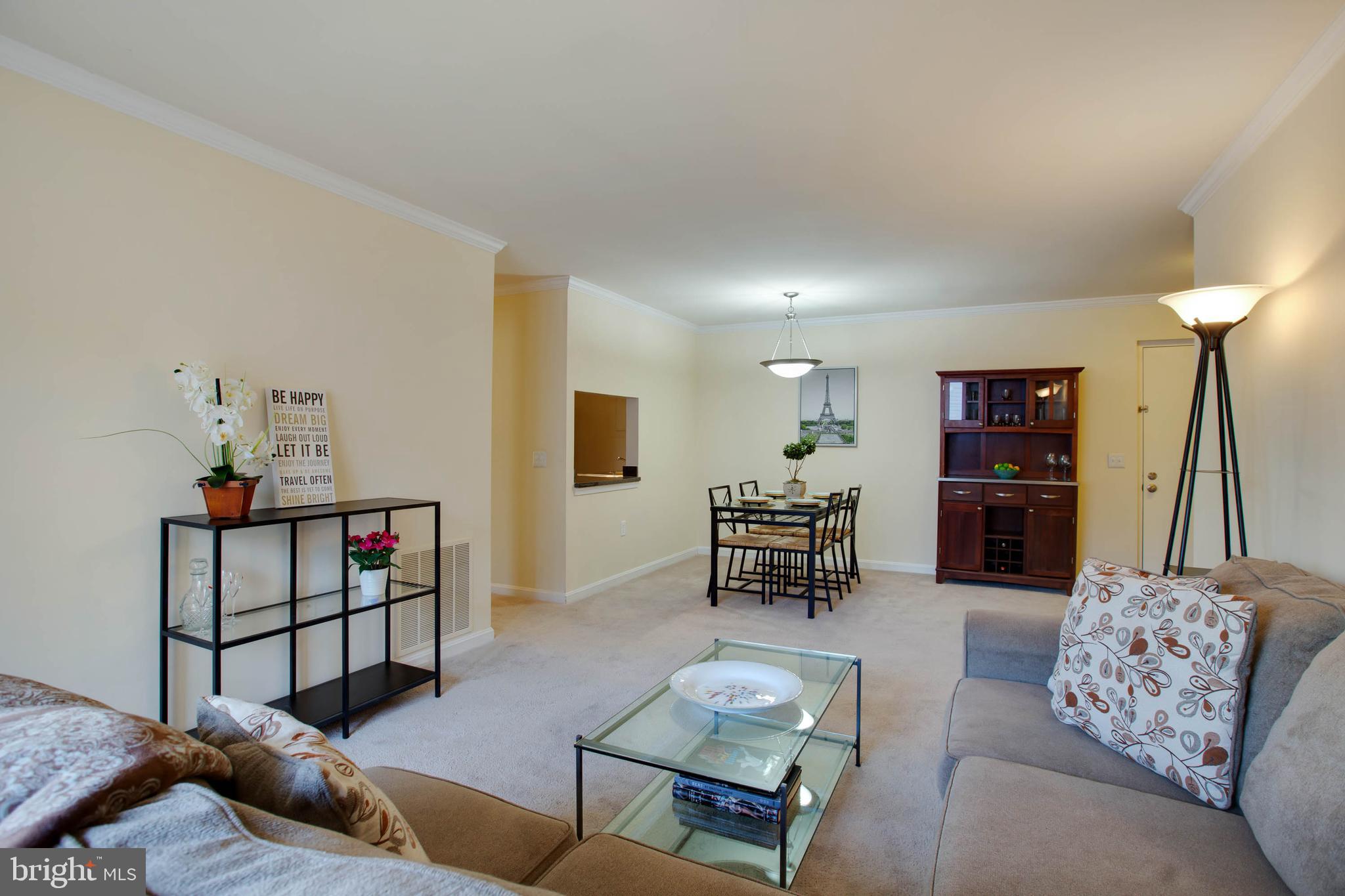 18318 Streamside Drive, Unit 203 Gaithersburg, MD 20879 - Photo 9 of 25 View of living room and dining room