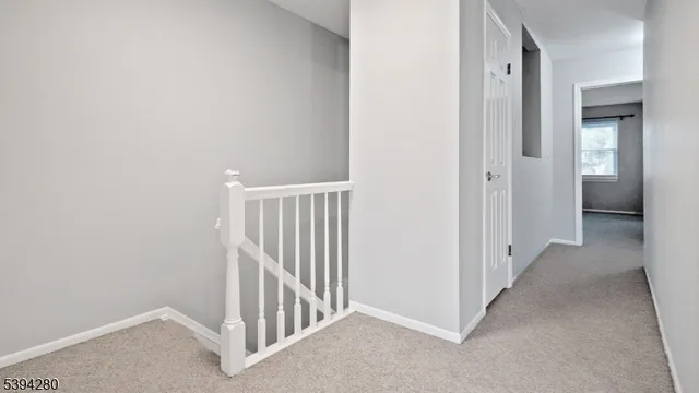 a view of a hallway with sliding door