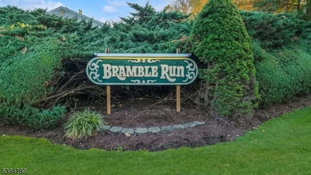 a view of a back yard with a table and a wooden fence