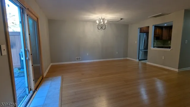 a view of a livingroom with wooden floor