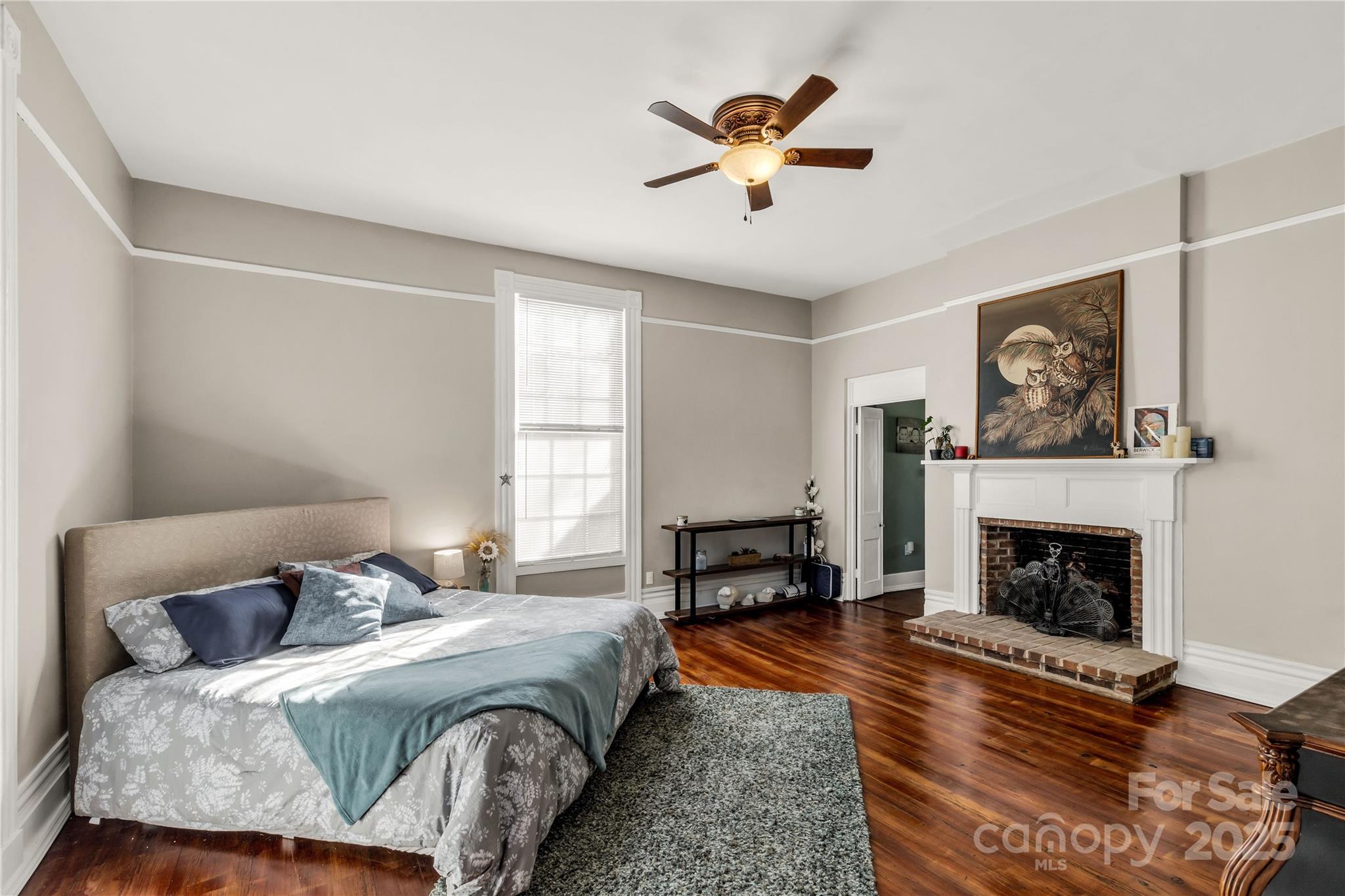 226 Liberty Street East York, SC 29745 - Photo 15 of 48 a bedroom with a bed and a fireplace