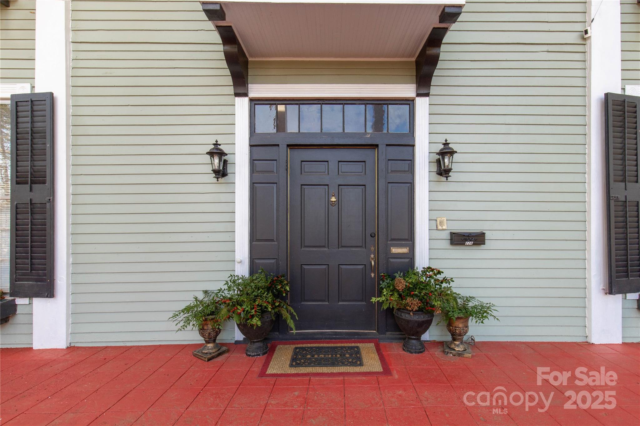 226 Liberty Street East York, SC 29745 - Photo 2 of 48 a potted plant sitting in front of a house