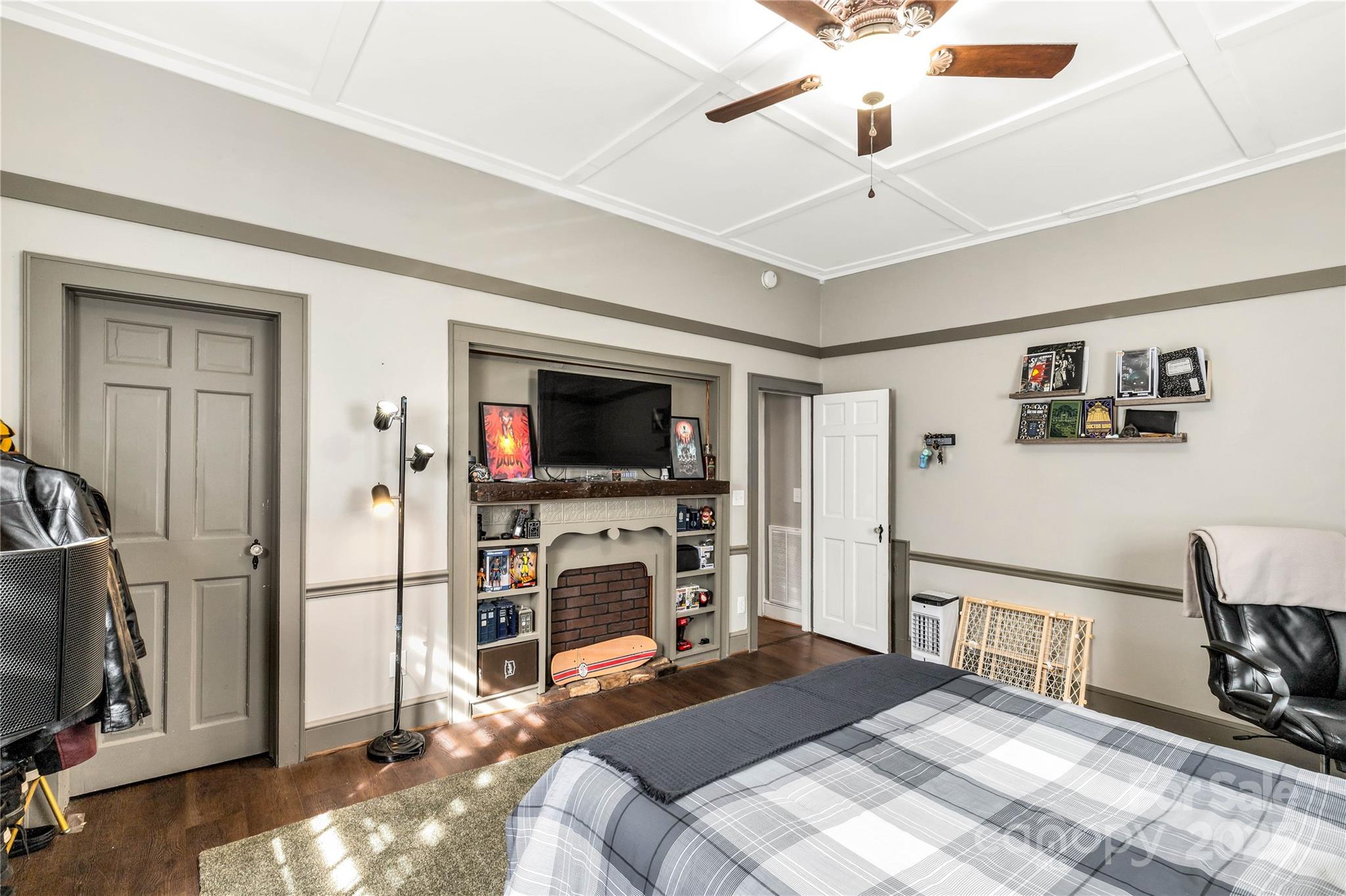 226 Liberty Street East York, SC 29745 - Photo 23 of 48 a bedroom with a bed a flat screen tv and a couch