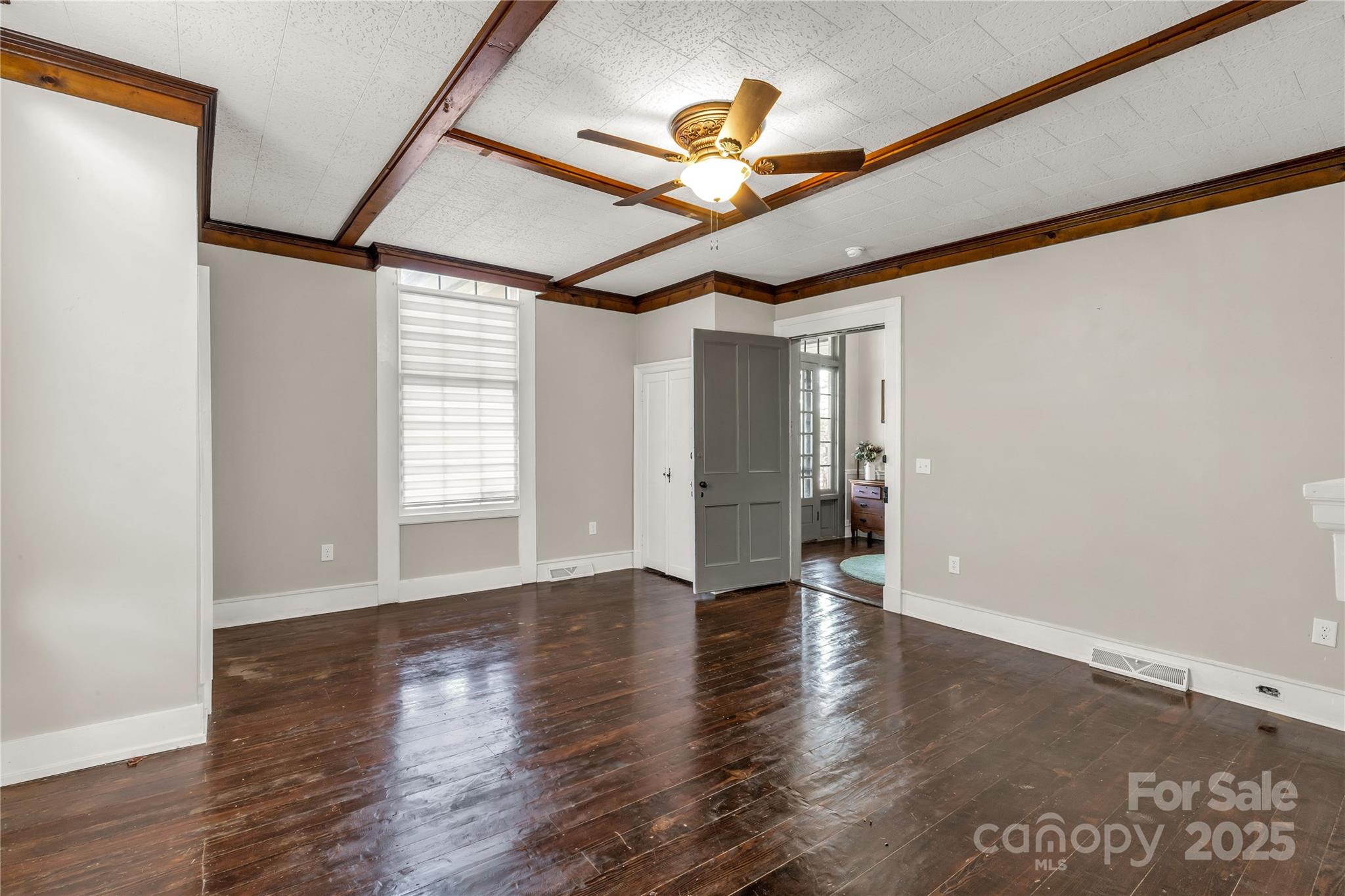 226 Liberty Street East York, SC 29745 - Photo 28 of 48 a view of an empty room with a window and wooden floor