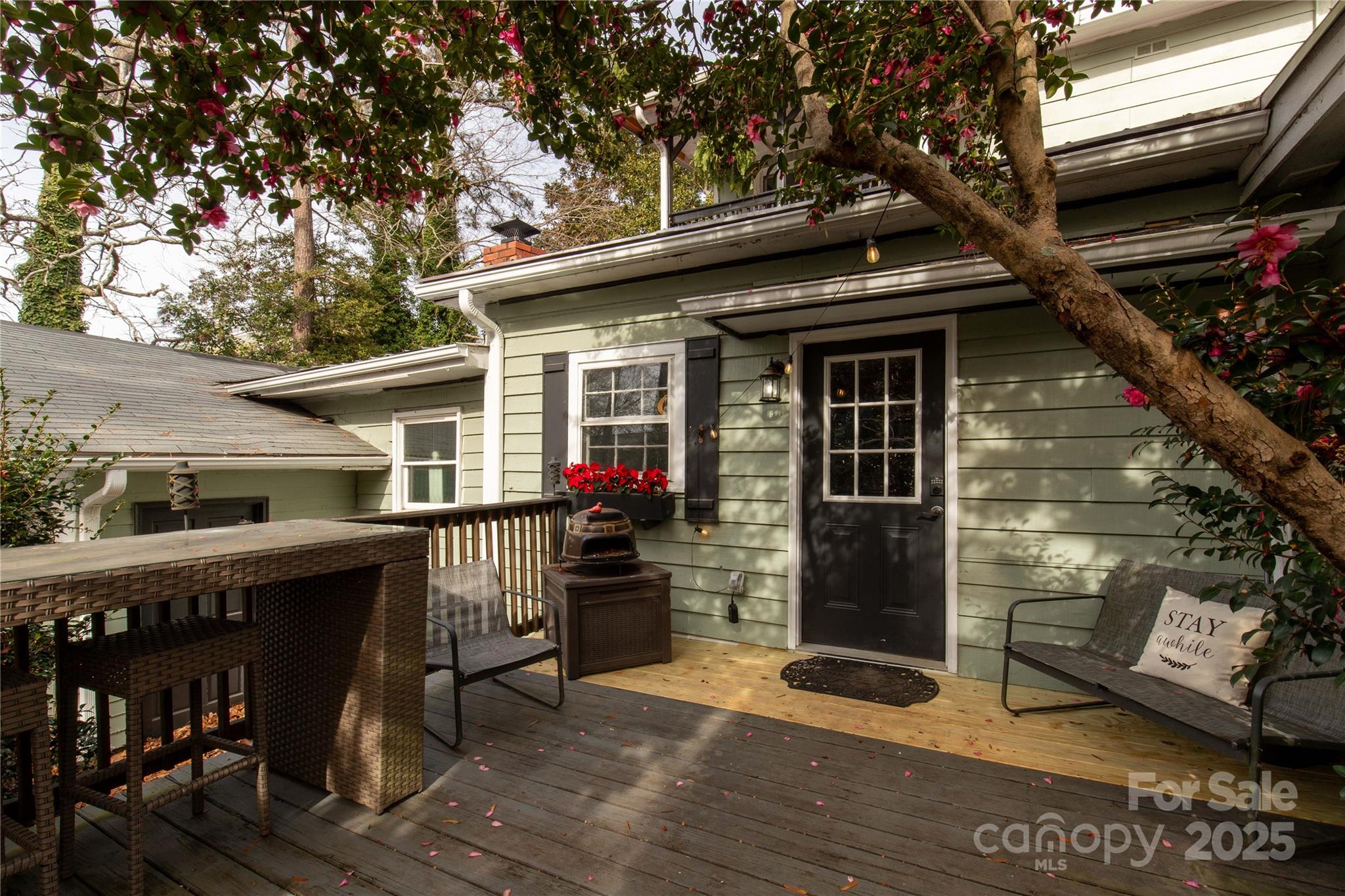 226 Liberty Street East York, SC 29745 - Photo 44 of 48 a backyard of a house with wooden table and chairs