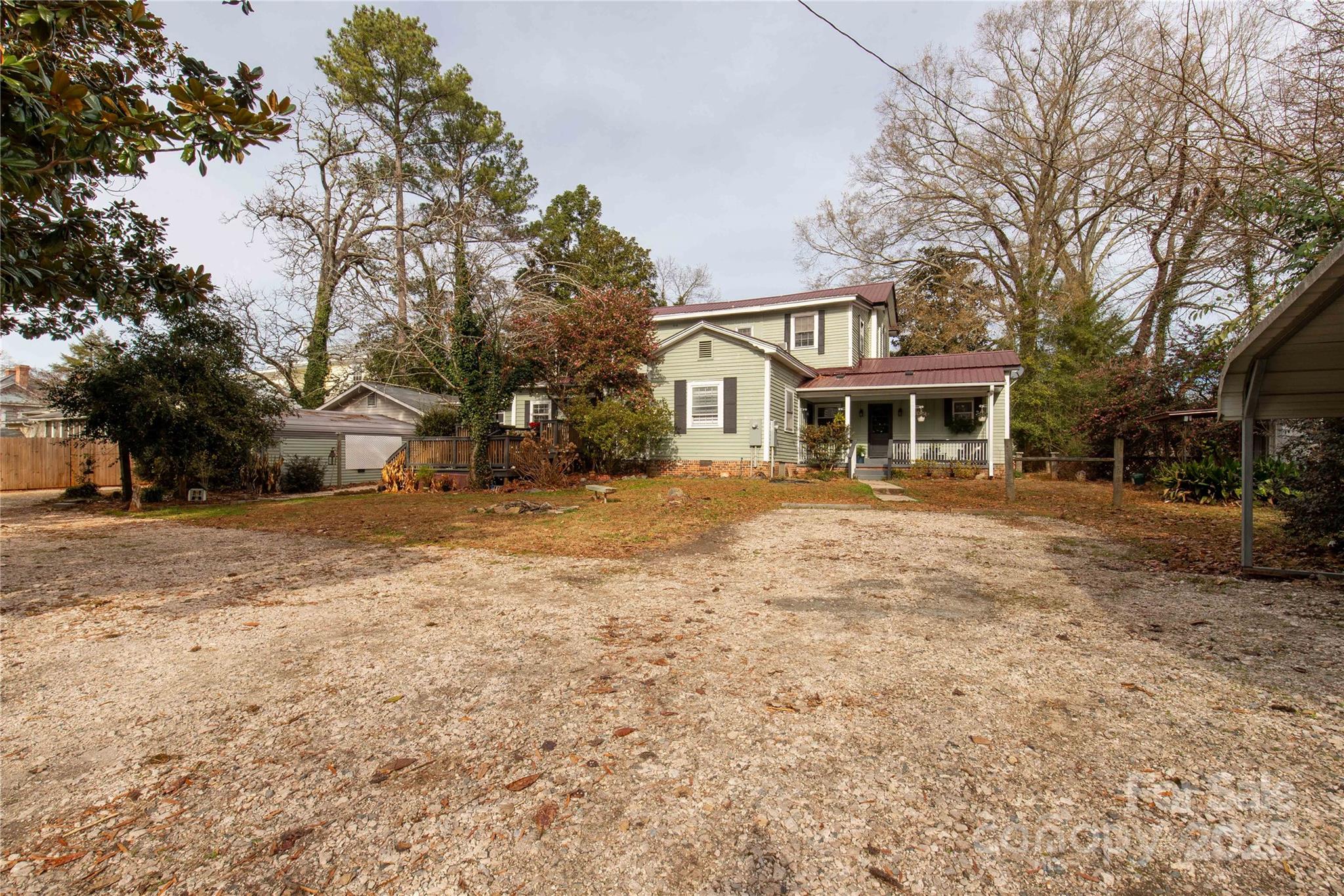 226 Liberty Street East York, SC 29745 - Photo 45 of 48 a view of a white house with a yard covered in snow