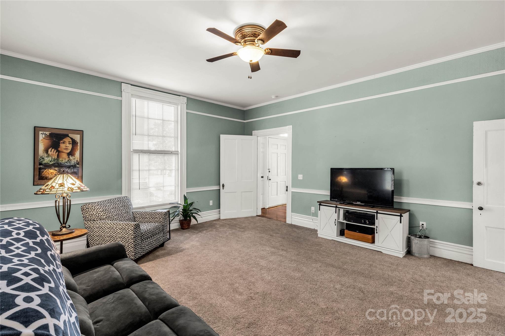 226 Liberty Street East York, SC 29745 - Photo 5 of 48 a living room with furniture and a flat screen tv