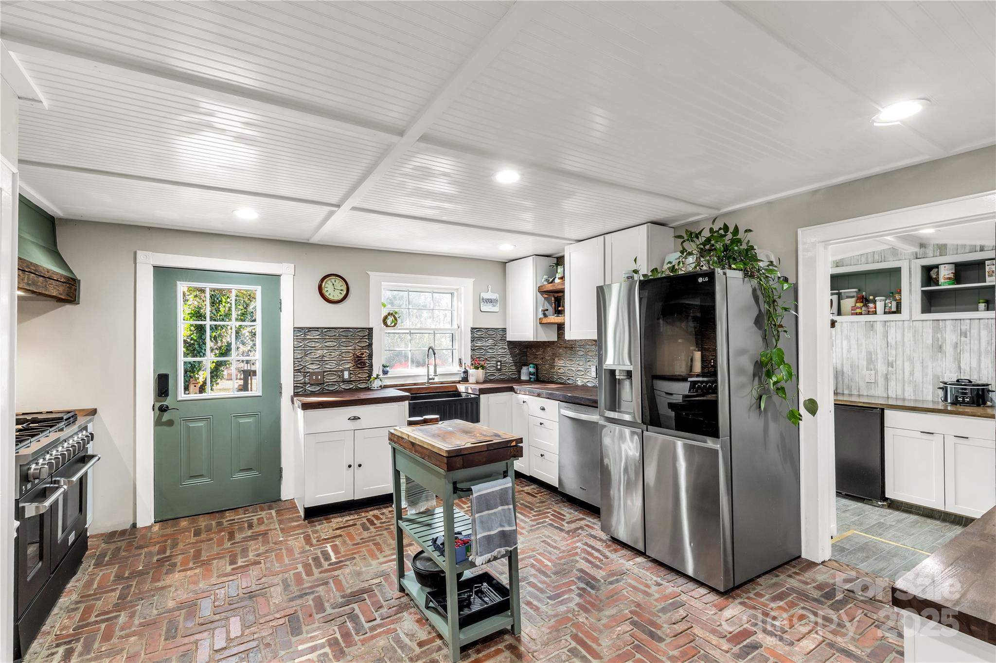 226 Liberty Street East York, SC 29745 - Photo 6 of 48 a kitchen with stainless steel appliances kitchen island granite countertop a refrigerator and a stove top oven