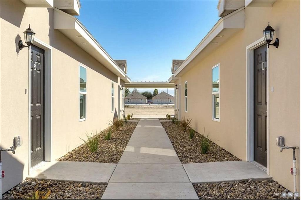 410 Downing Avenue, Unit 2 Edinburg, TX 78539 - Photo 5 of 5 a view of a hallway with wooden floor and a living room