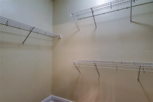 a view of a room with racks on the wall