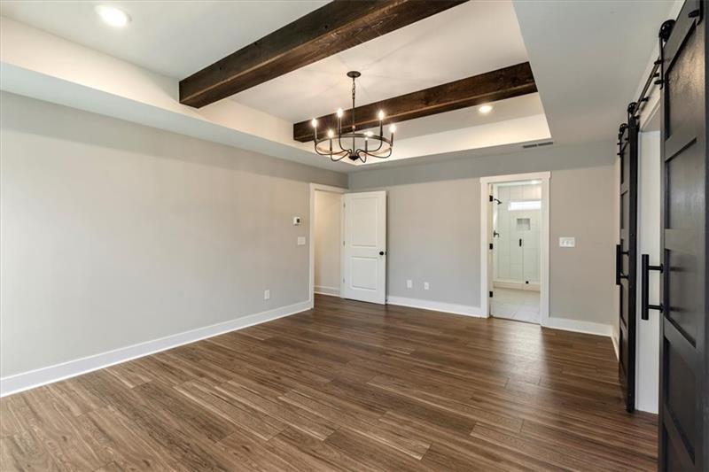 131 Old Alabama Road Southeast Emerson, GA 30137 - Photo 21 of 44 a view of a big room with wooden floor and windows