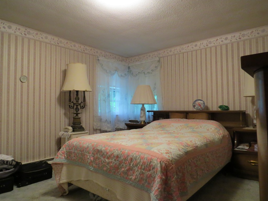 29 Birchwood Road Rutland, MA 01543 - Photo 11 of 17 a bed room with a bed and a lamp