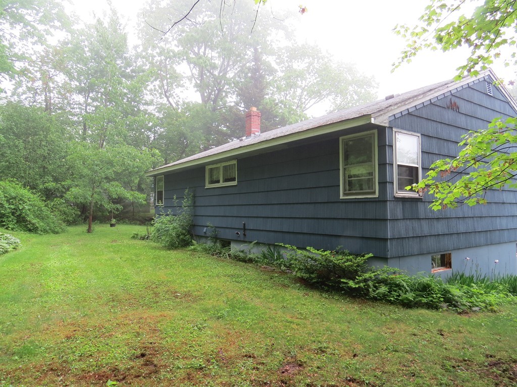 29 Birchwood Road Rutland, MA 01543 - Photo 2 of 17 a view of a backyard with plants
