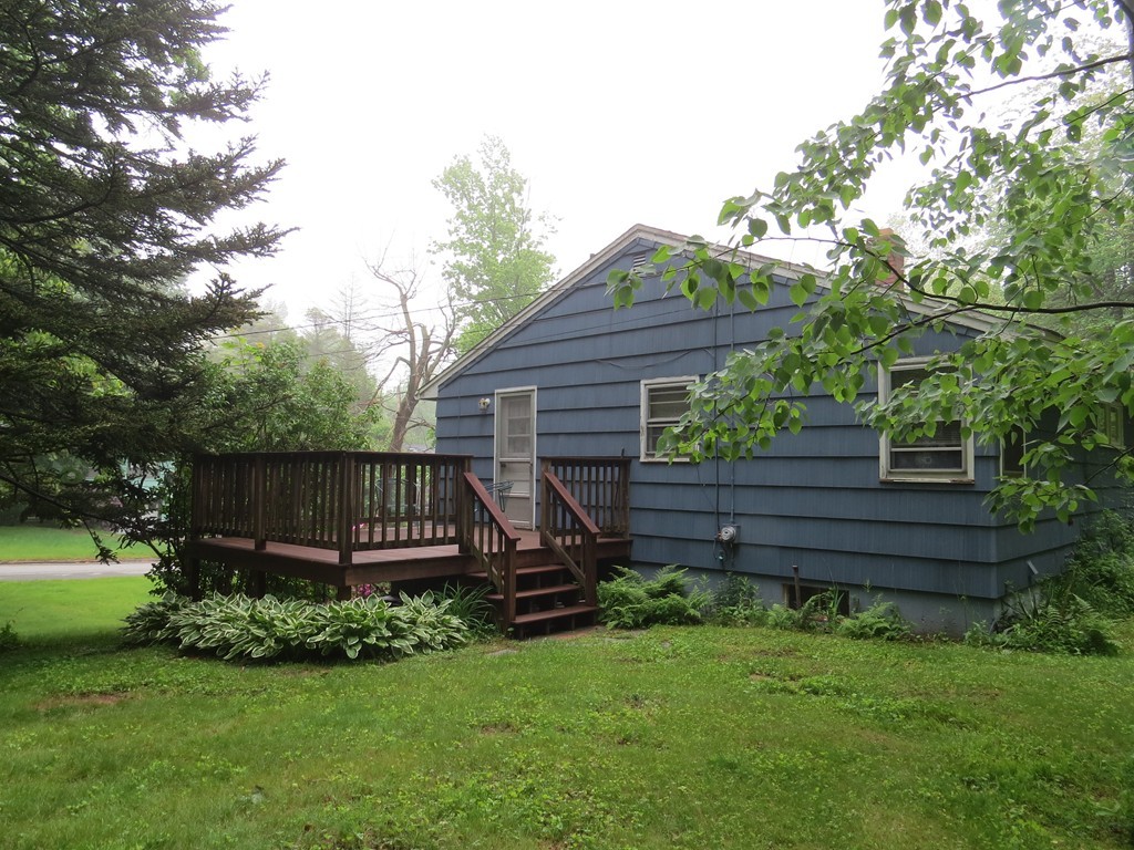 29 Birchwood Road Rutland, MA 01543 - Photo 3 of 17 a view of a house with a yard plants and large tree