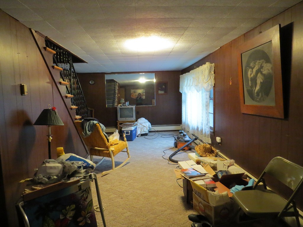 29 Birchwood Road Rutland, MA 01543 - Photo 5 of 17 a bedroom with furniture and stairs
