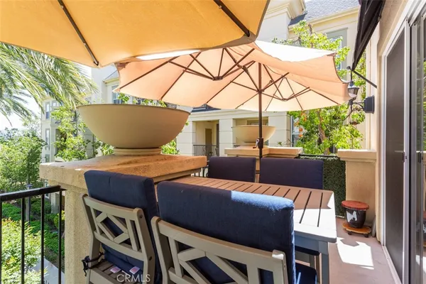 a outdoor space with patio the couches and potted plants