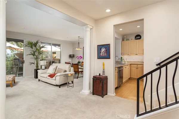a living room with furniture and large windows