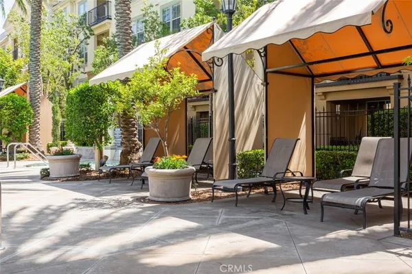 a view of the patio with chairs and tables