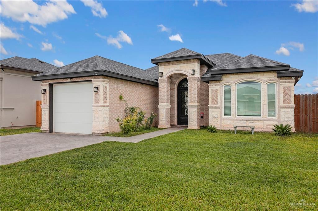 502 Oak Ridge Street Donna, TX 78537 - Photo 2 of 28 a view of a house with a yard