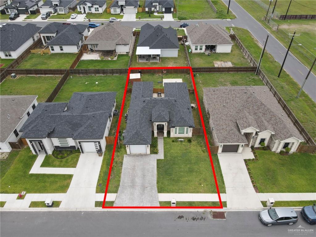 502 Oak Ridge Street Donna, TX 78537 - Photo 21 of 28 an aerial view of houses with outdoor space