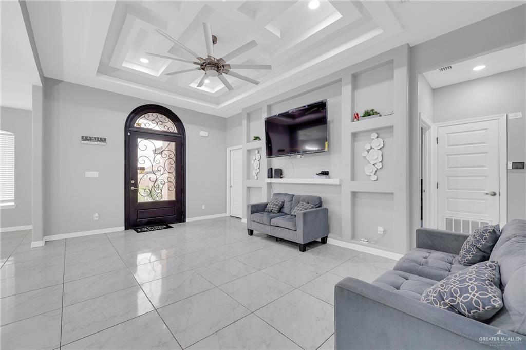 502 Oak Ridge Street Donna, TX 78537 - Photo 6 of 28 a living room with furniture and a flat screen tv