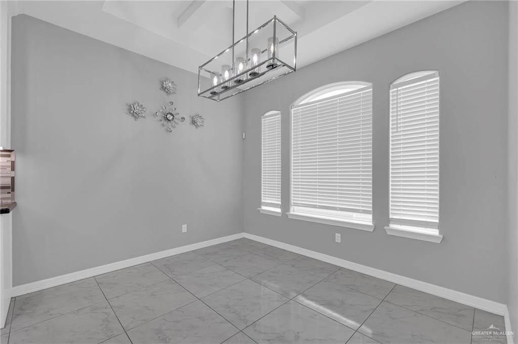 502 Oak Ridge Street Donna, TX 78537 - Photo 8 of 28 a view of a livingroom with a chandelier