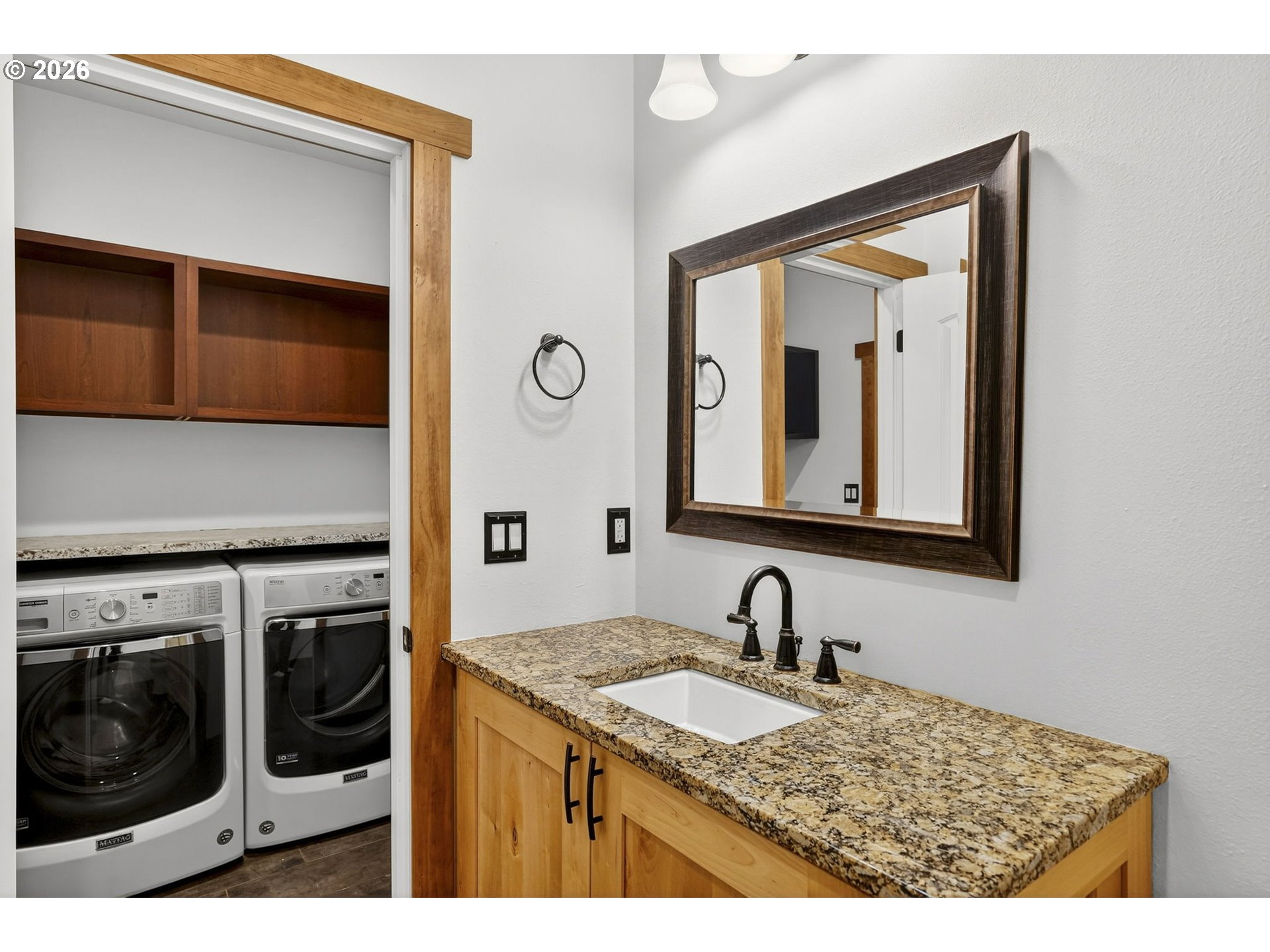 24677 Southeast Van Curen Road Eagle Creek, OR 97022 - Photo 15 of 48 a bathroom with a sink a mirror and cabinets