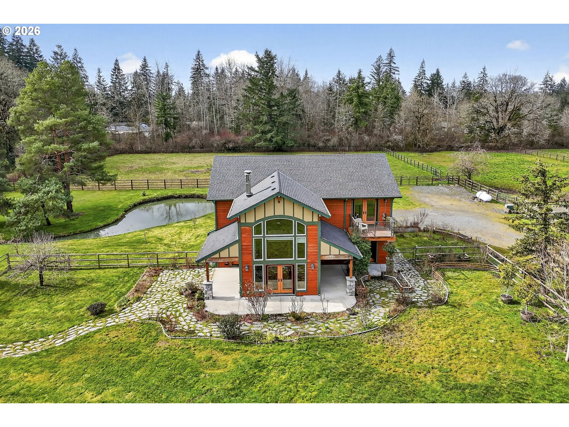 24677 Southeast Van Curen Road Eagle Creek, OR 97022 - Photo 2 of 48 a view of a big house with a big yard plants and large trees