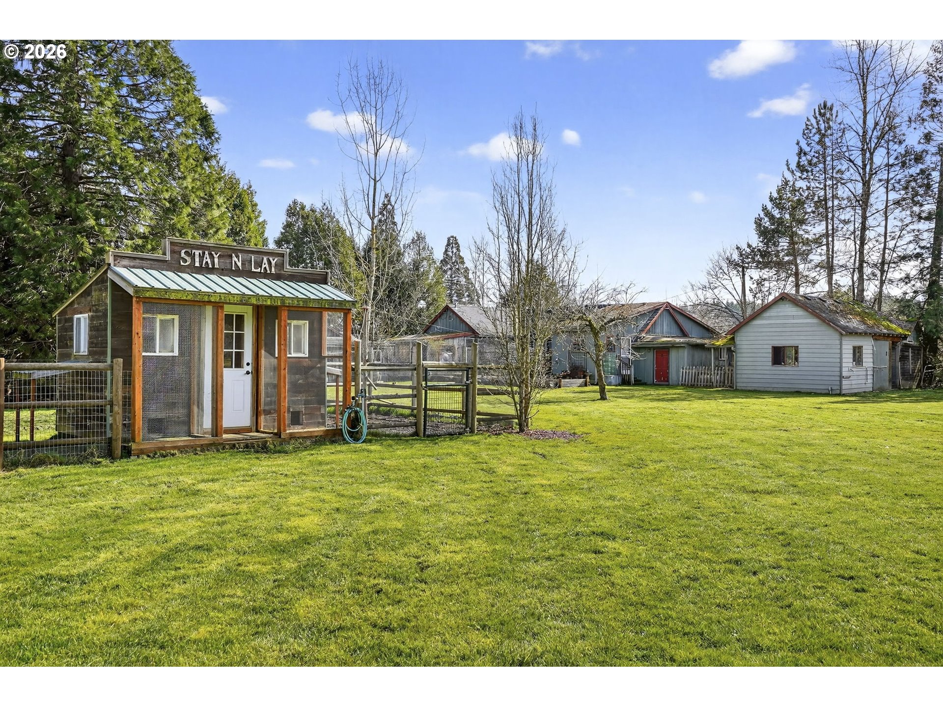 24677 Southeast Van Curen Road Eagle Creek, OR 97022 - Photo 31 of 48 a view of a house with a yard