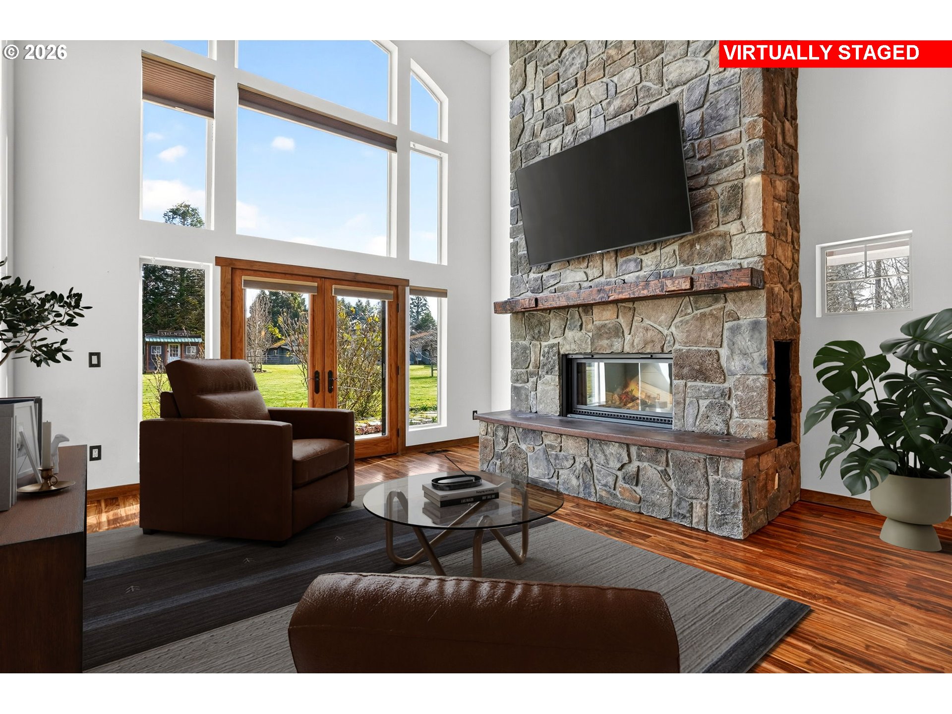 24677 Southeast Van Curen Road Eagle Creek, OR 97022 - Photo 5 of 48 a living room with furniture a flat screen tv and a fireplace
