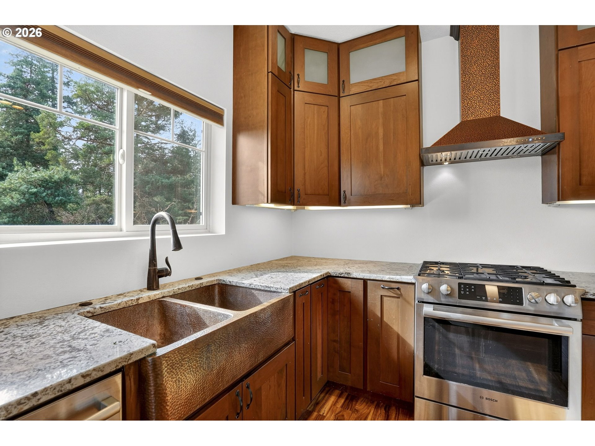 24677 Southeast Van Curen Road Eagle Creek, OR 97022 - Photo 7 of 48 a kitchen that has a sink and a stove
