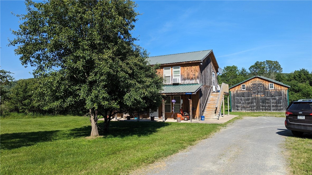 1418 County Highway Mount Vision, NY 13810 - Photo 1 of 1 Board and Batten siding on both buildings. metal roofs.