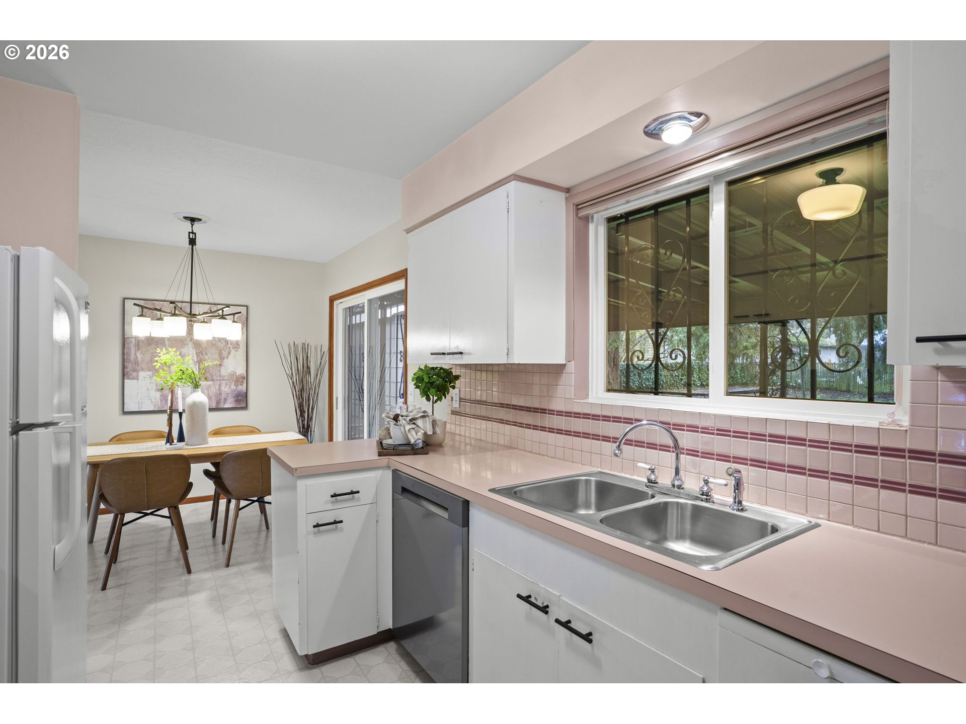 10531 Southeast Long Street Portland, OR 97266 - Photo 14 of 42 a kitchen with a sink stove and cabinets