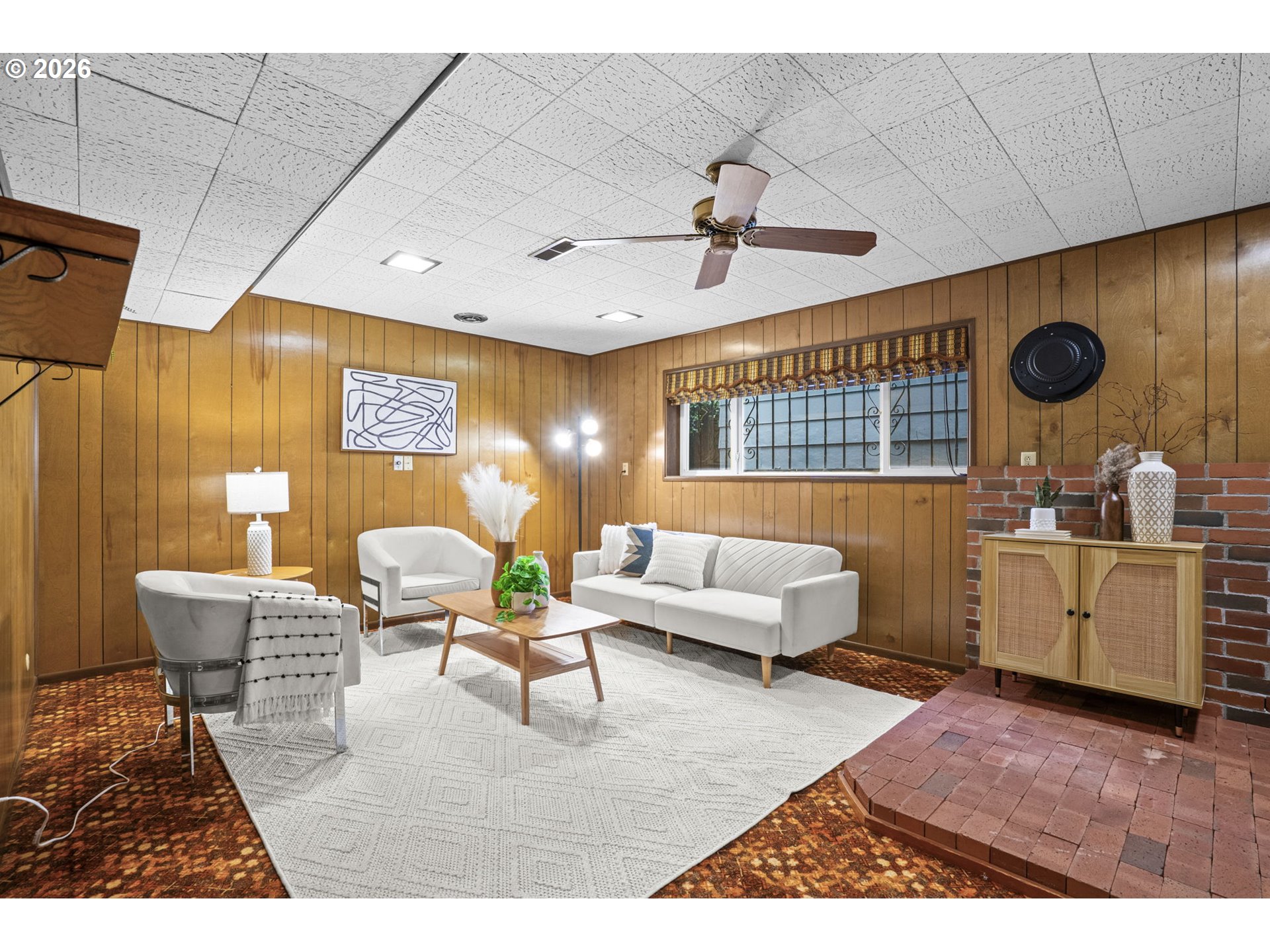 10531 Southeast Long Street Portland, OR 97266 - Photo 25 of 42 a living room with furniture and a flat screen tv