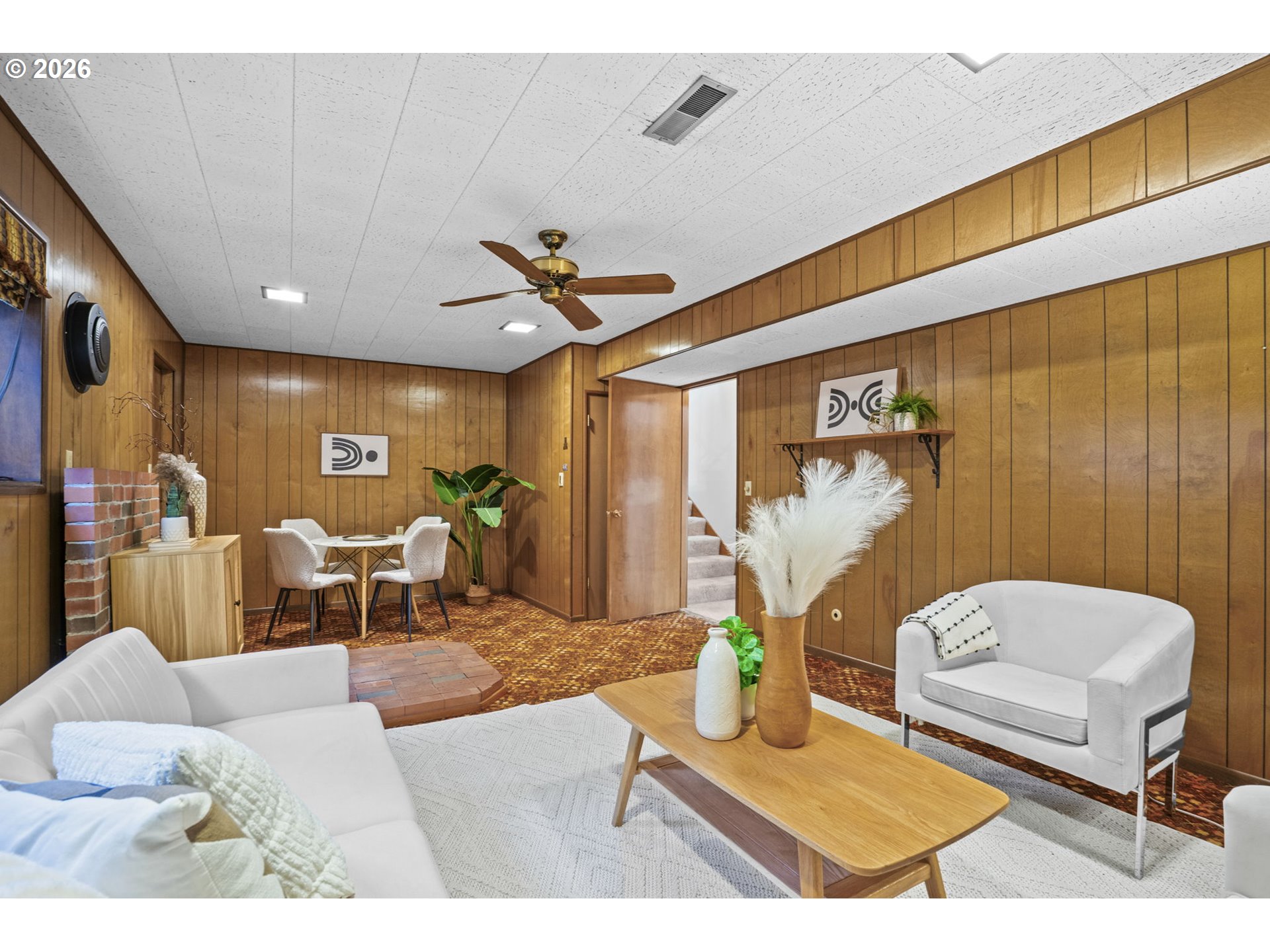 10531 Southeast Long Street Portland, OR 97266 - Photo 28 of 42 a living room with furniture and a chandelier