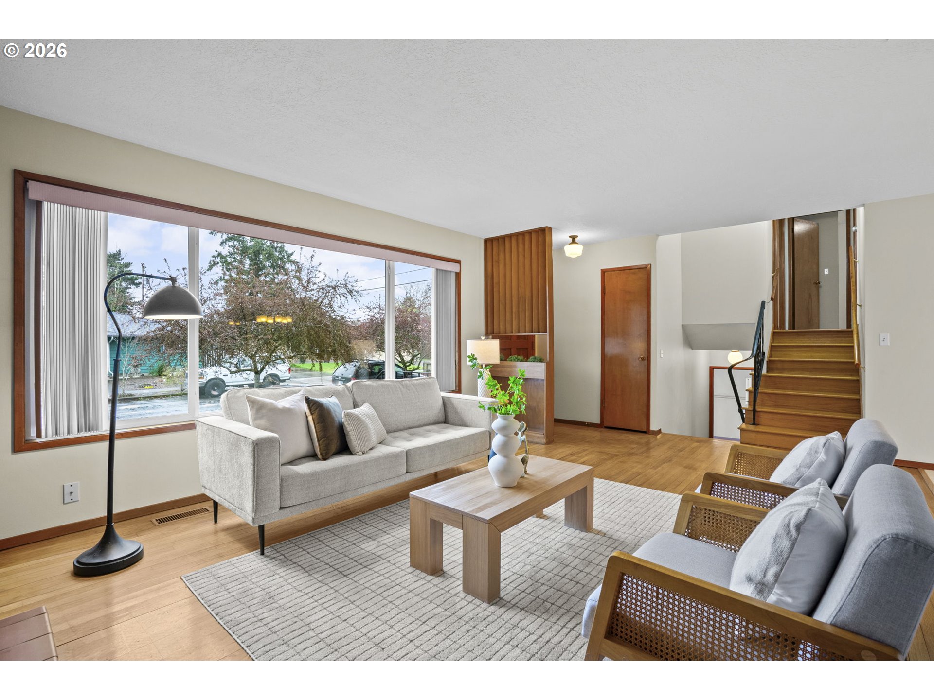 10531 Southeast Long Street Portland, OR 97266 - Photo 7 of 42 a living room with furniture and a large window