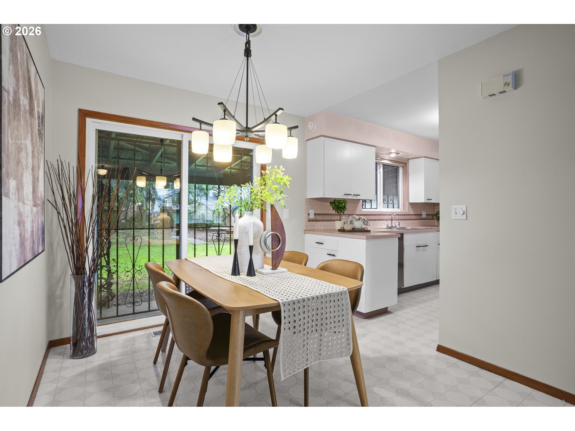 10531 Southeast Long Street Portland, OR 97266 - Photo 8 of 42 a view of a dining room with furniture wooden floor and chandelier
