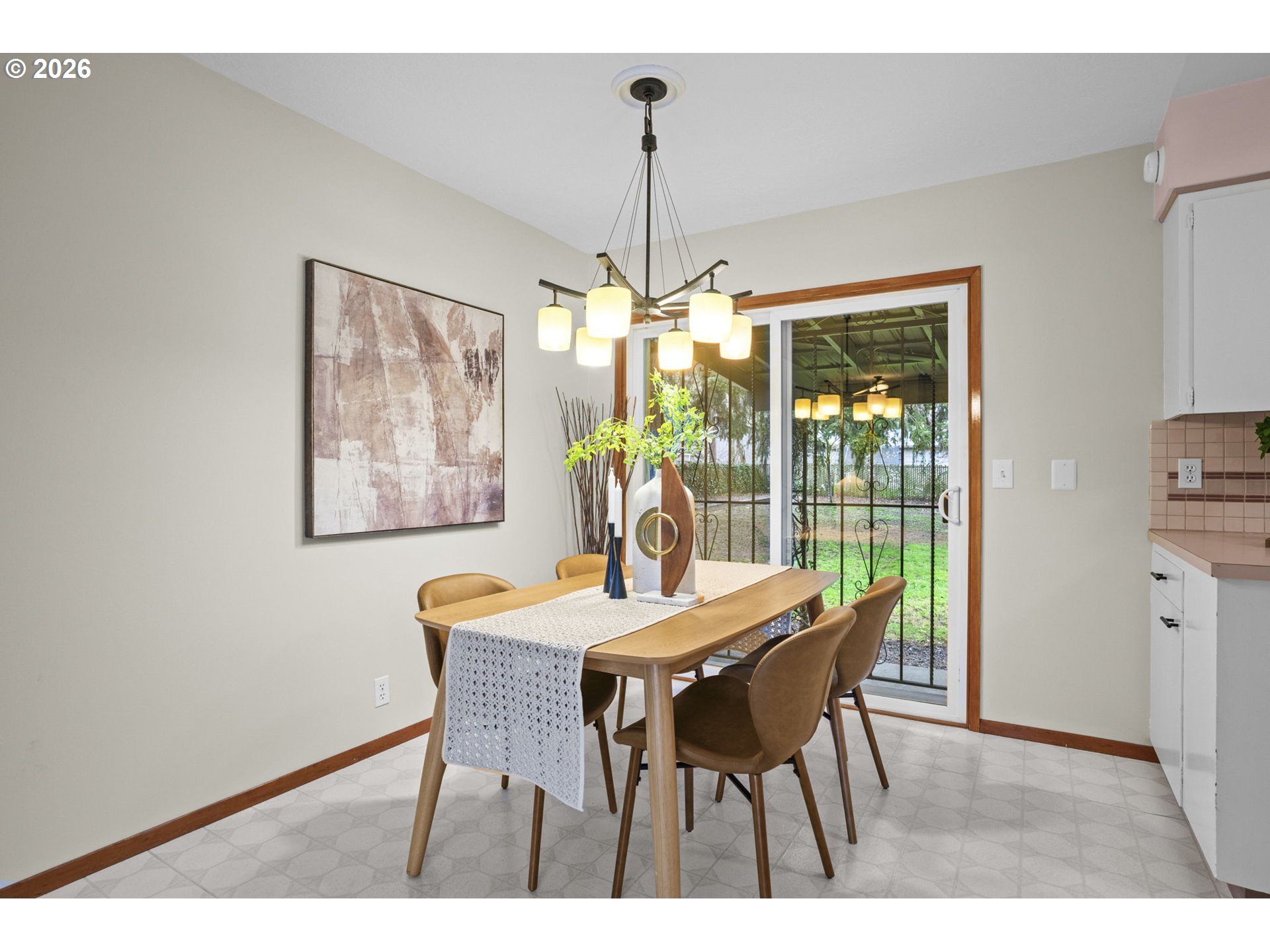 10531 Southeast Long Street Portland, OR 97266 - Photo 9 of 42 a dining room with furniture a chandelier and window