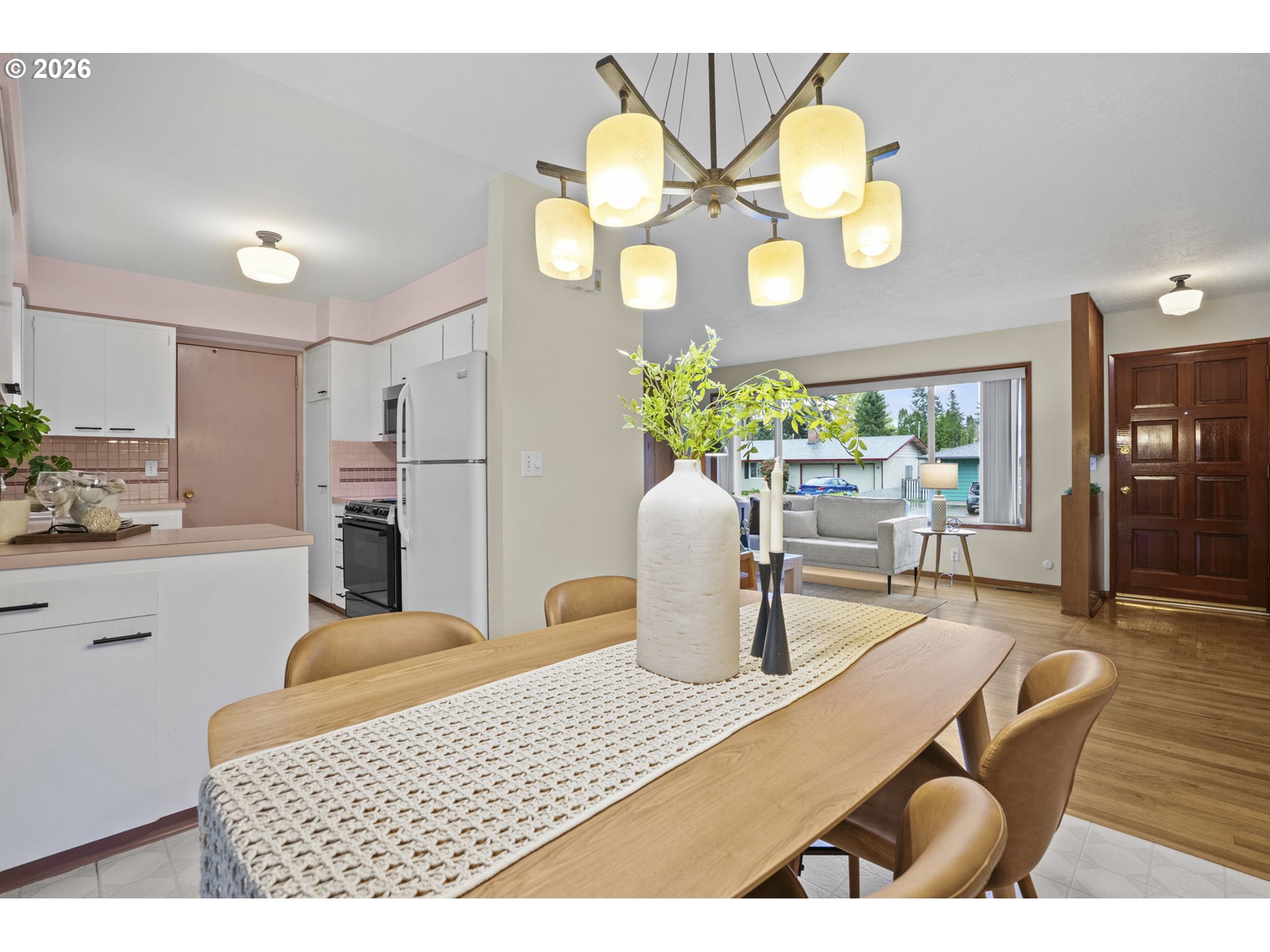 10531 Southeast Long Street Portland, OR 97266 - Photo 10 of 42 a dining room filled chandelier and wooden floor