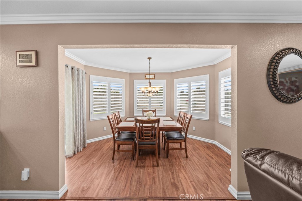 20257 Edmund Road Riverside, CA 92508 - Photo 22 of 53 a view of a dining room with furniture window and wooden floor
