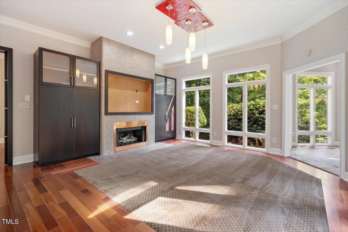 6300 Swallow Cove Lane Raleigh, NC 27614 - Photo 12 of 67 a large hall with a fireplace and windows