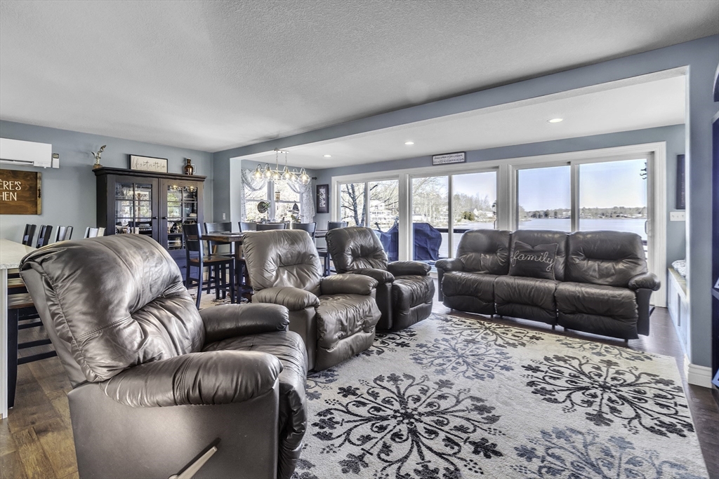15 Grove Point Road Wales, MA 01081 - Photo 13 of 43 a living room with furniture and a large window