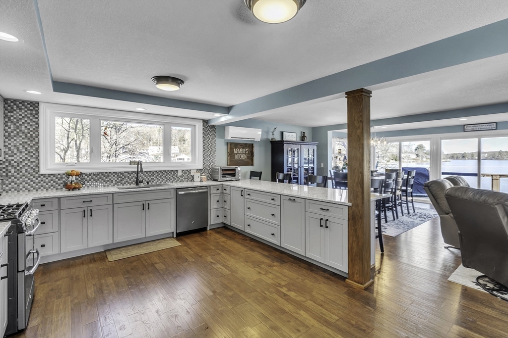 15 Grove Point Road Wales, MA 01081 - Photo 6 of 43 a large white kitchen with window and wooden floor