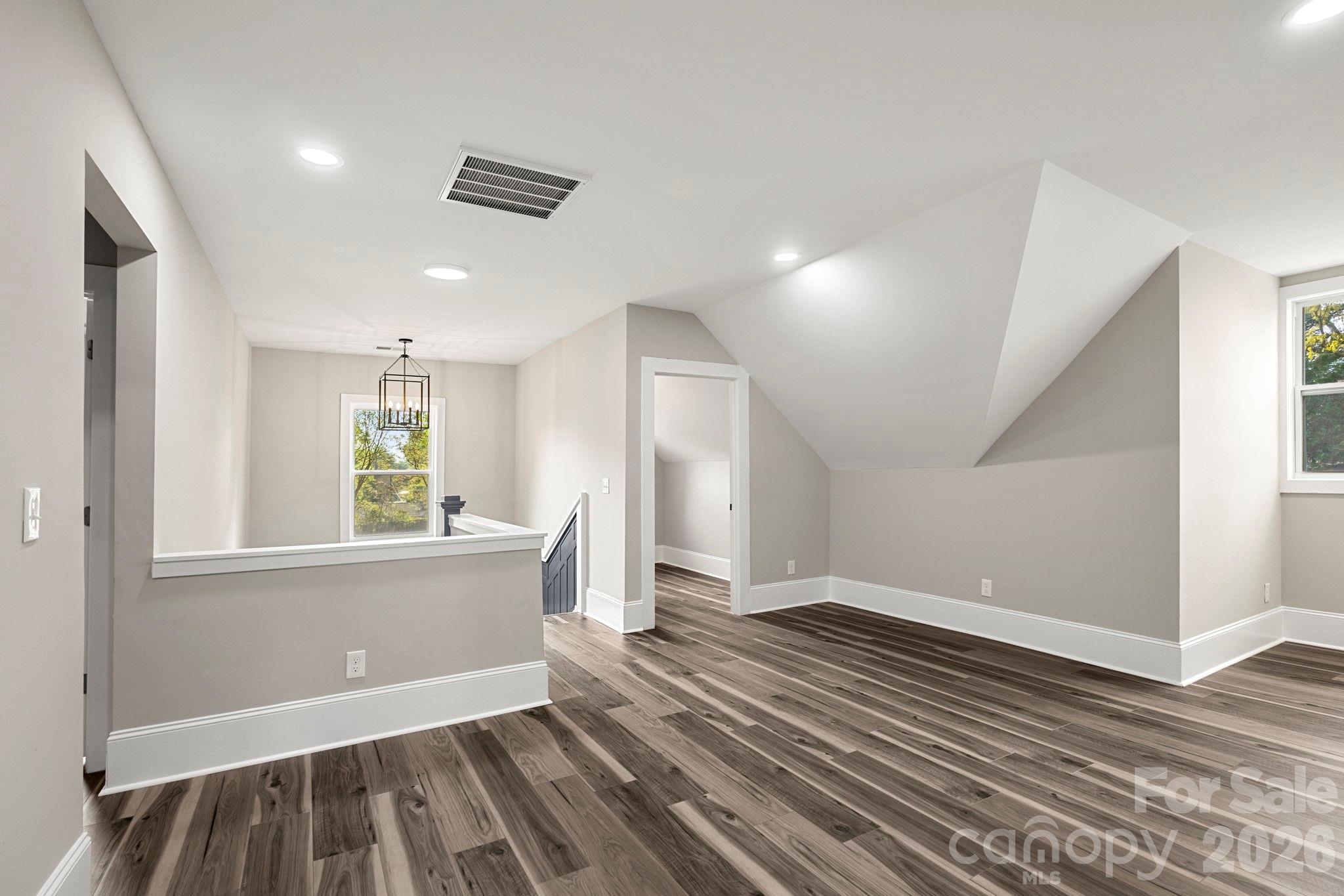 918 North New Hope Road Gastonia, NC 28054 - Photo 32 of 37 an empty room with wooden floor and windows