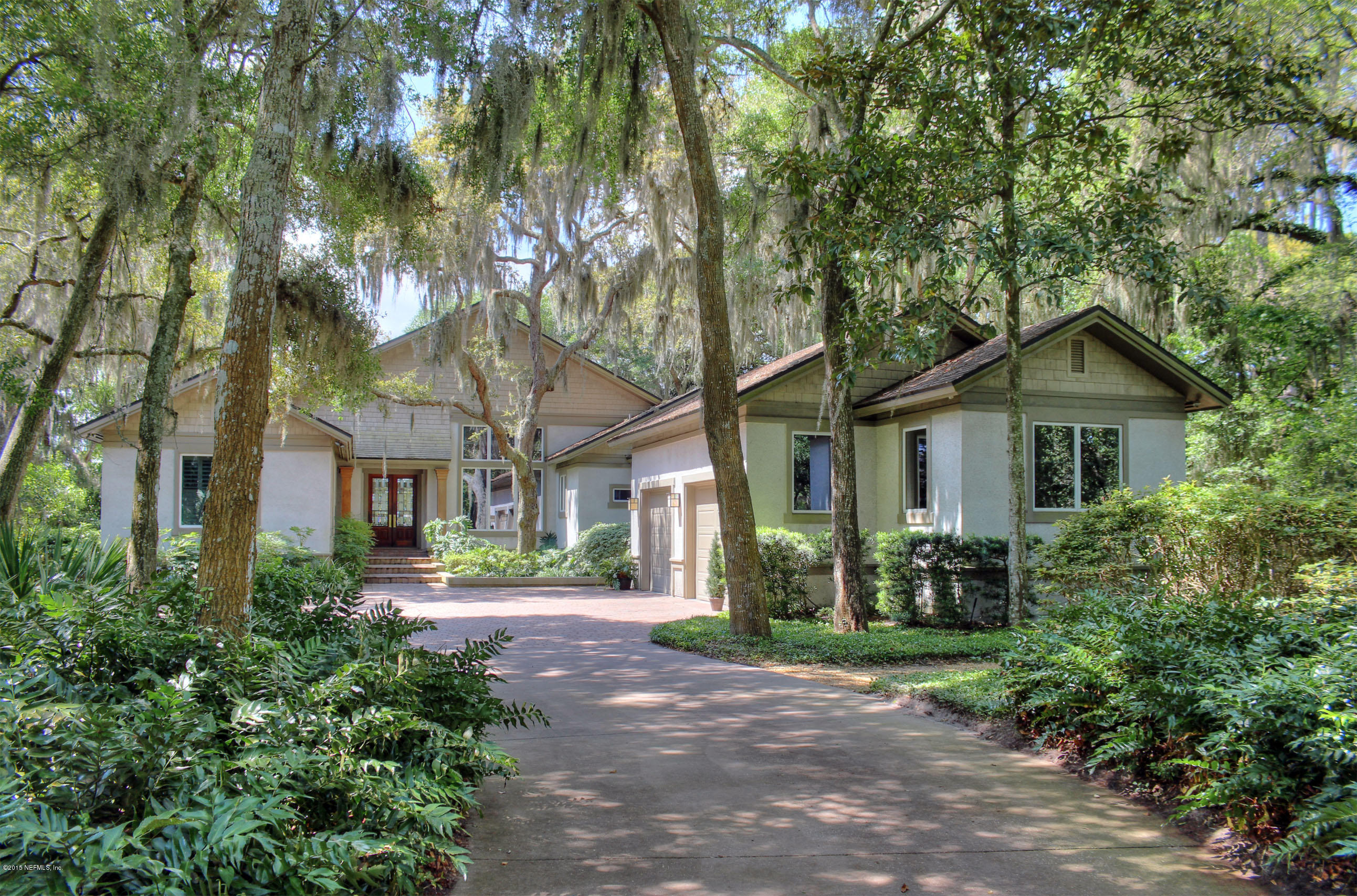 22 Sea Marsh Road Fernandina Beach, FL 32034 - Photo 1 of 24 a front view of house with yard and trees around